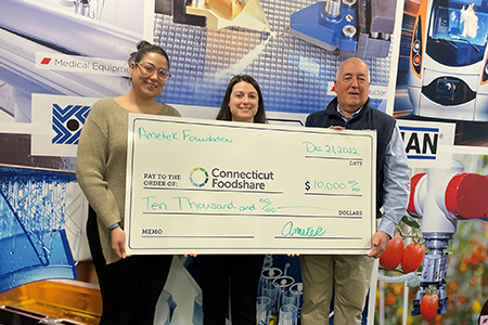 Haydon Kerk Pittman team members present a check from the AMETEK Foundation to non-profit Connecticut Foodshare